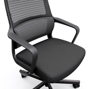 Angled partial mid- to lower view of modern black fabric and metal adjustable office chair on a white background
