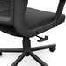 Angled partial lower view of modern black fabric and metal adjustable office chair on a white background