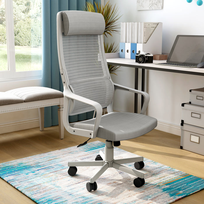 Angled view of modern gray fabric and metal adjustable office chair in work space with furnishings and accessories