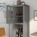 Left angled close up vintage gray oak multi-shelf accent bookcase with one door open in a living area with accessories
