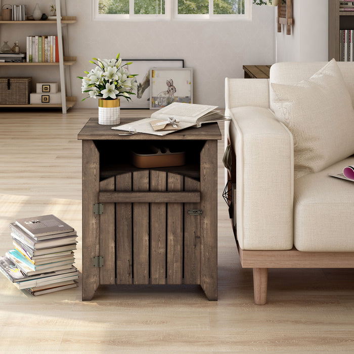 Front-facing modern farmhouse side table with a reclaimed oak finish, two shelves and gate-style door in a casual living room with accessories