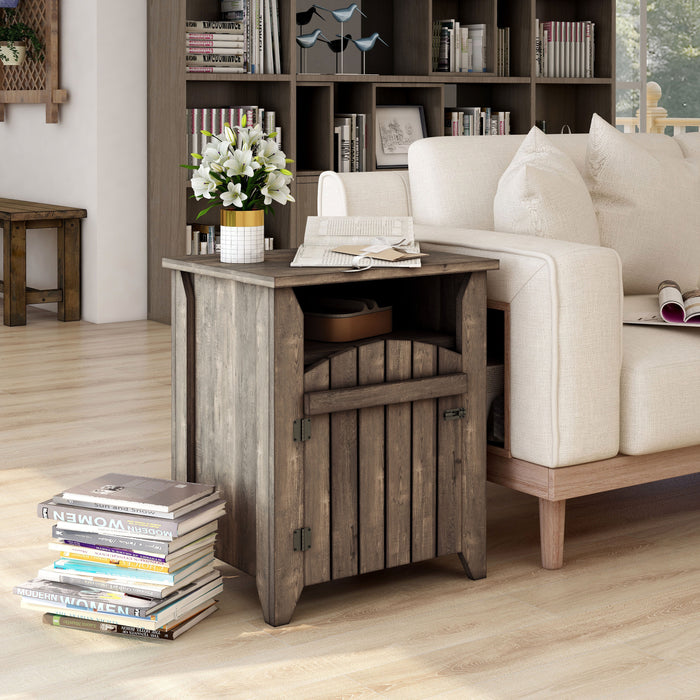 Right-angled modern farmhouse side table with a reclaimed oak finish, two shelves and gate-style door in a casual living room with accessories