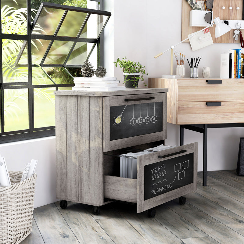 Right-facing rustic vintage gray oak file cabinet with two chalk panel drawers and casters in a modern home office space.