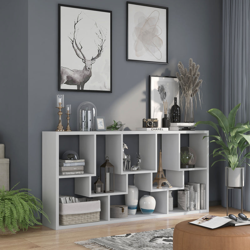 Right angled top view modern white geometric bookcase with staggered shelves laid horizontally in a living room with accessories