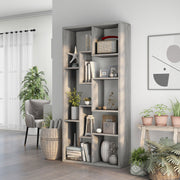 Left angled modern vintage gray oak geometric bookcase with staggered shelves in a living area with accessories