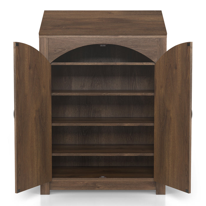 Front-facing transitional distressed walnut shoe cabinet opened to reveal four adjustable shelves over a white background. Arched plank style doors with rustic black pulls and hinges.