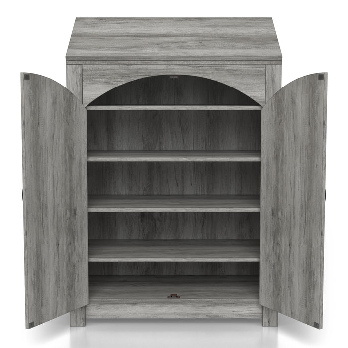Front-facing transitional vintage gray oak shoe cabinet opened to reveal four adjustable shelves over a white background. Arched plank style doors with rustic black pulls and hinges.