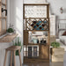 Front-facing light hickory one-door 11-bottle wine rack with stemware storage in a living area with accessories