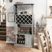 Left angled vintage gray oak one-door 11-bottle wine rack with stemware storage in a living area with accessories