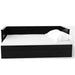 Front-facing cottage style black daybed with three drawers and white linens on a white background
