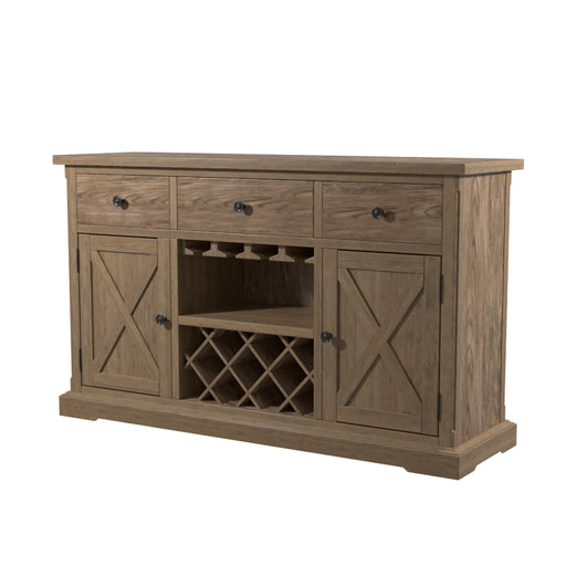 Left angled light oak wine bar cabinet against a white background. The X-slatted cabinets flanking a trellis wine rack on a toe-kick base create a rustic farmhouse look. Three knobbed drawers perch just above the stemware rack.