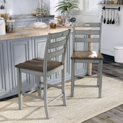 Light grey ladderback counter height chair against a white background.