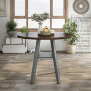 Front-facing rustic wood drop-leaf dining table with a wood finish top and colored base in a casual breakfast nook with accessories