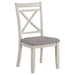 Right angled contemporary antique white side chair with gray fabric on a white background