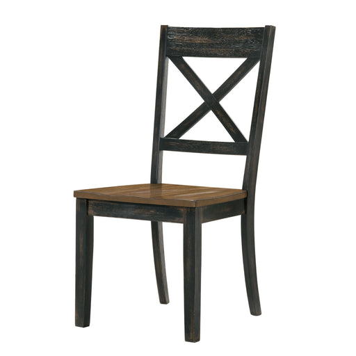 Left angled rustic antique oak and black X-back dining chair on a white background