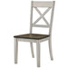 Left angled rustic tall dressernut and antique white X-back dining chair on a white background