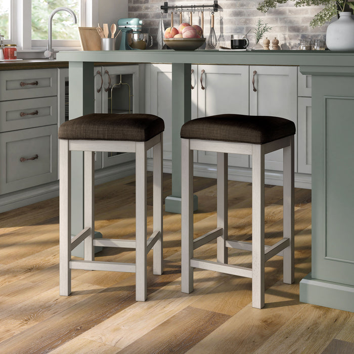 Left-angled two rustic antique white counter height stools with dark brown fabric seats in the dining room