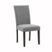 Right angled transitional gray fabric side chair with nailhead trim on a white background