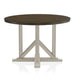 Front-facing view of rustic dark oak round dining table with an antique white trestle pedestal base on a white background