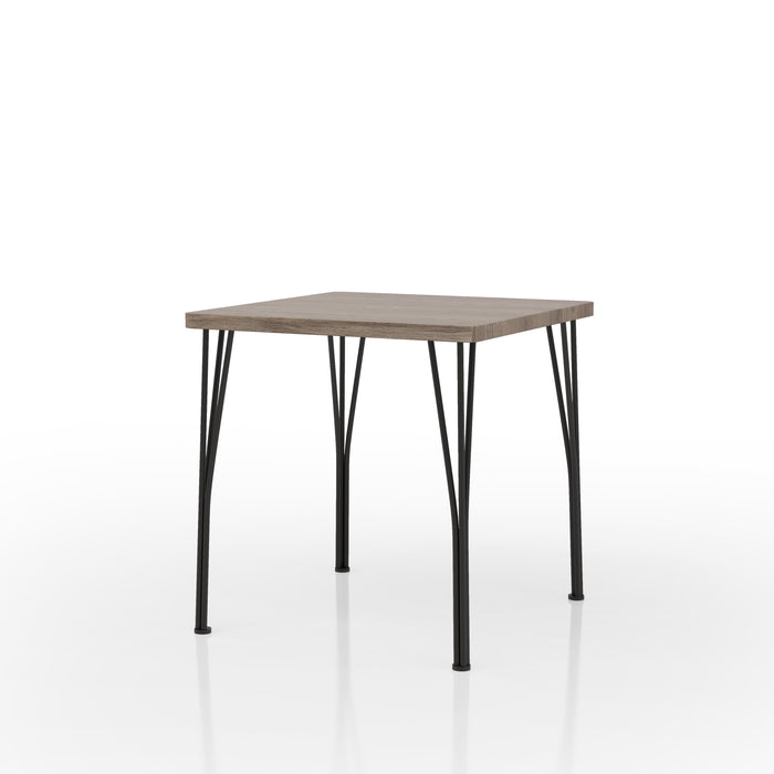 Left-angled square bistro table with split metal legs and gray wood grain tabletop on a white background