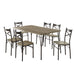 Left-angled seven-piece casual dining set with a rectangular wood grain table and six X-strap chairs on a white background