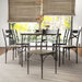 Front-facing seven-piece casual dining set with a rectangular wood grain table and six X-strap chairs in a casual dining room with accessories