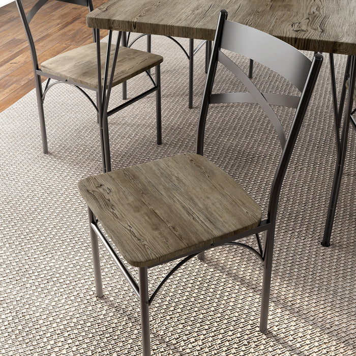 Left-angled close up X-strap chairs in a casual dining room with accessories