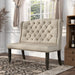 Left-angled ambrosia transitional beige nailhead trim fabric loveseat dining bench in a living room with accessories