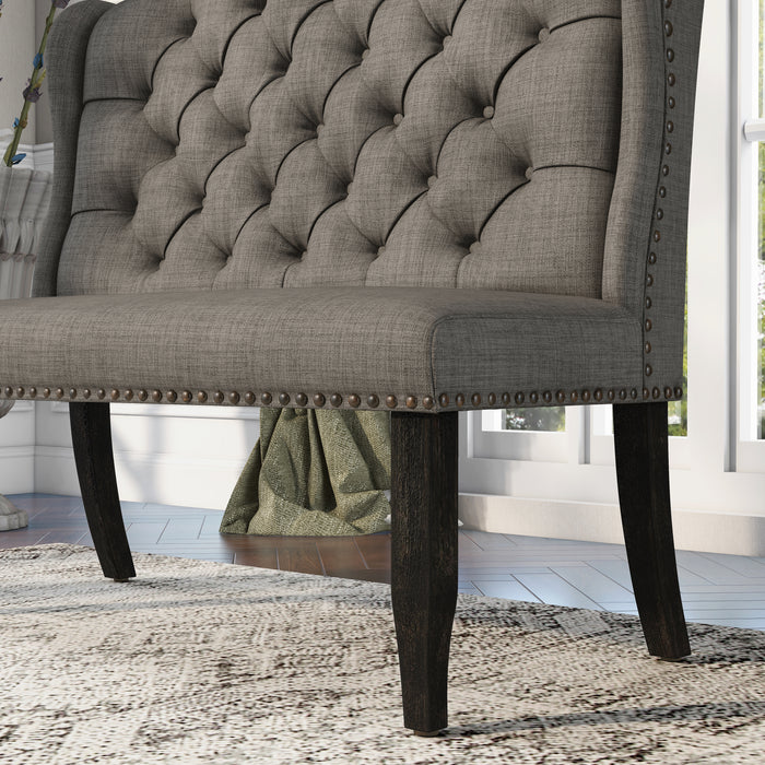  Left-angled close up ambrosia transitional light gray fabric loveseat dining bench with detail of nailhead trim in a living room with accessories