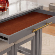 Detail shot of contemporary light gray nesting counter height table in a dining room with decor and matching stools