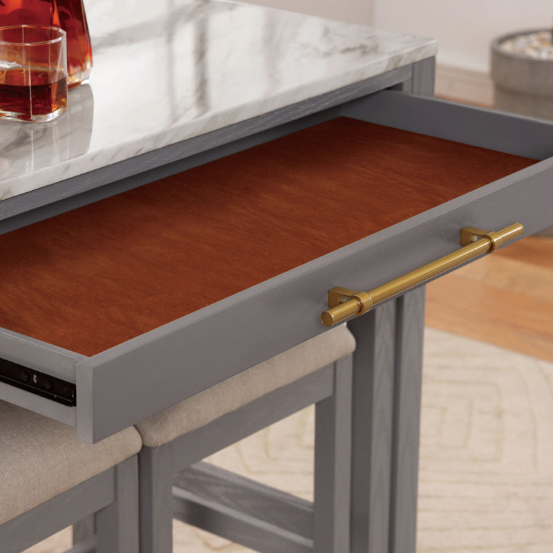 Detail shot of contemporary light gray nesting counter height table in a dining room with decor and matching stools