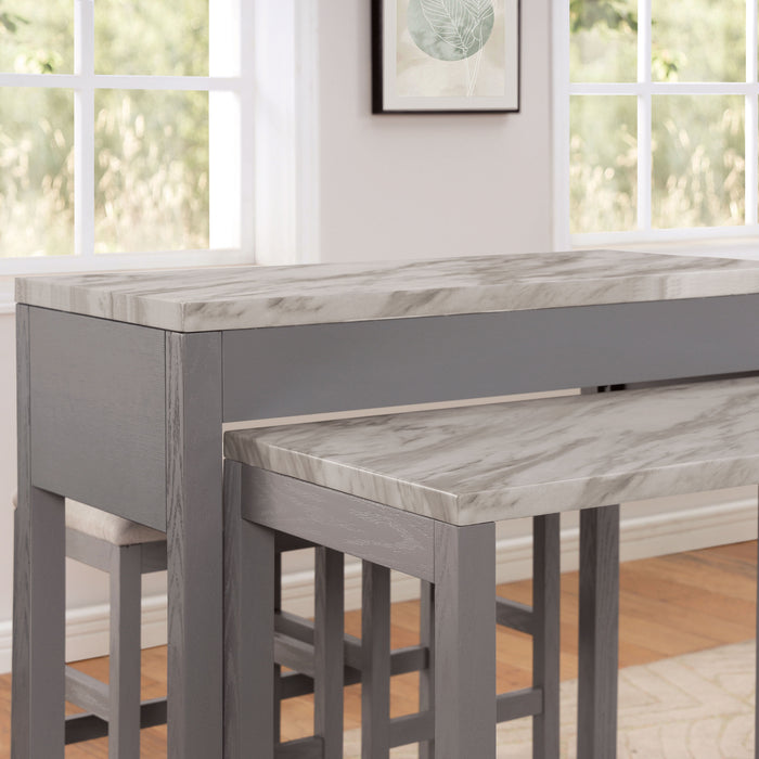 Detail shot of contemporary light gray nesting counter height table in a dining room with decor and matching stools