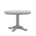 Front-facing contemporary round pedestal dining table with a white faux marble top on a white background