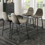 Left angled set of four mid-century modern counter height chairs with button tufting in a living area with accessories