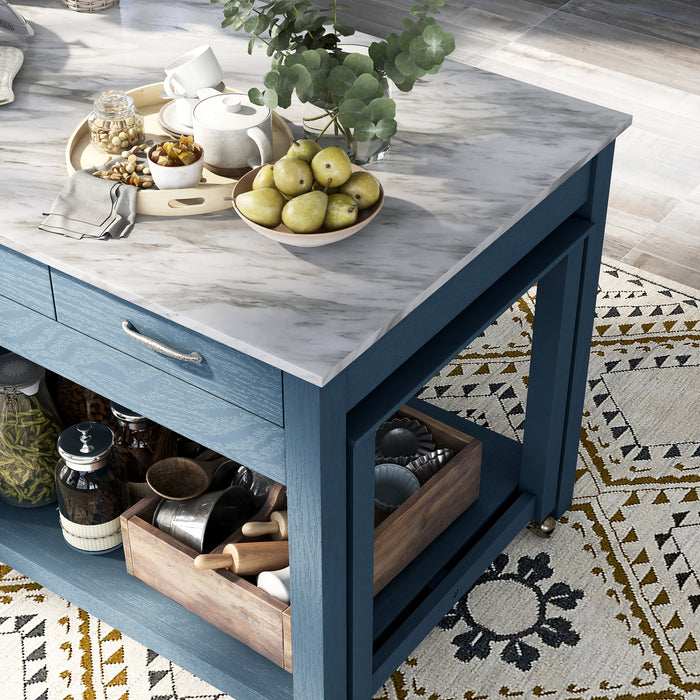 Top-down close-up detail view of white marble-like tabletop on a farmhouse blue counter height table with decor in kitchen setting