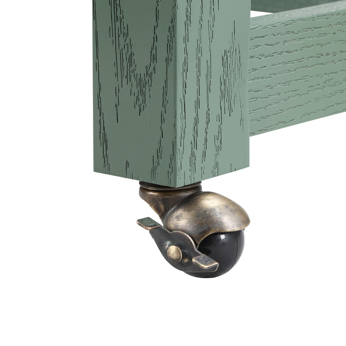 Close-up detail view of rolling metal caster wheels on extendable table of farmhouse green counter height table on a white background