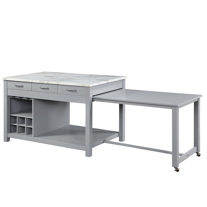 Left angled view of farmhouse light gray counter height table with white marble-like tabletop and extended table on a white background
