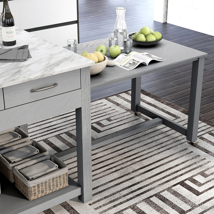 Right angled top-down view of extended hidden table and white marble-like tabletop of farmhouse light gray counter height table with decor in a kitchen 