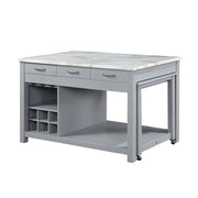 Left angled view of farmhouse light gray counter height table with white marble-like tabletop and open storage on a white background