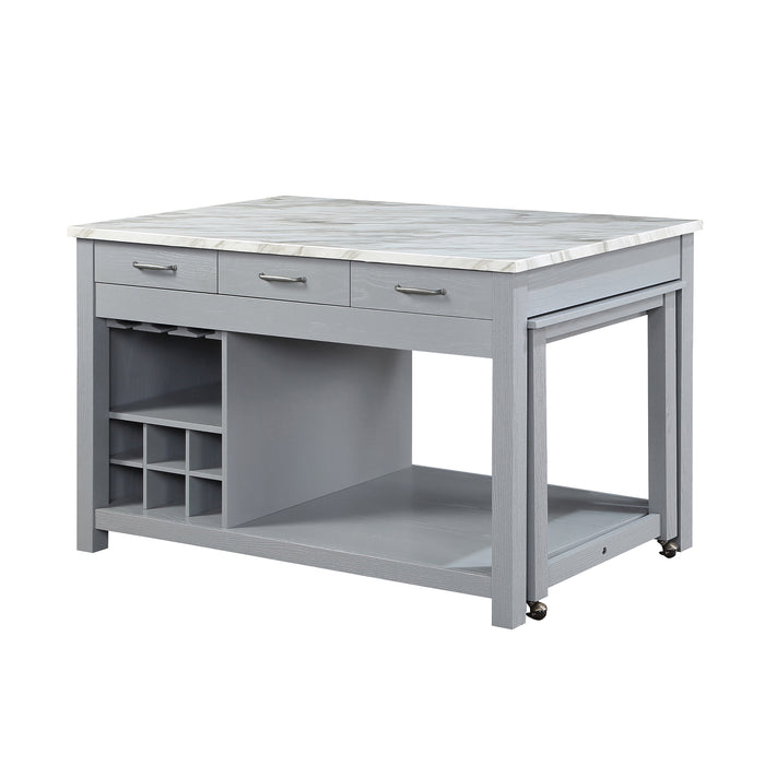 Left angled view of farmhouse light gray counter height table with white marble-like tabletop and open storage on a white background 