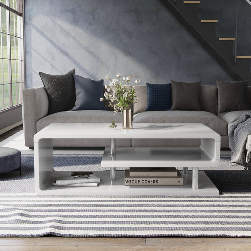 Front-facing contemporary white geometric coffee table in a living room with accessories