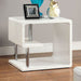 Right angled contemporary white geometric end table in a living room with accessories