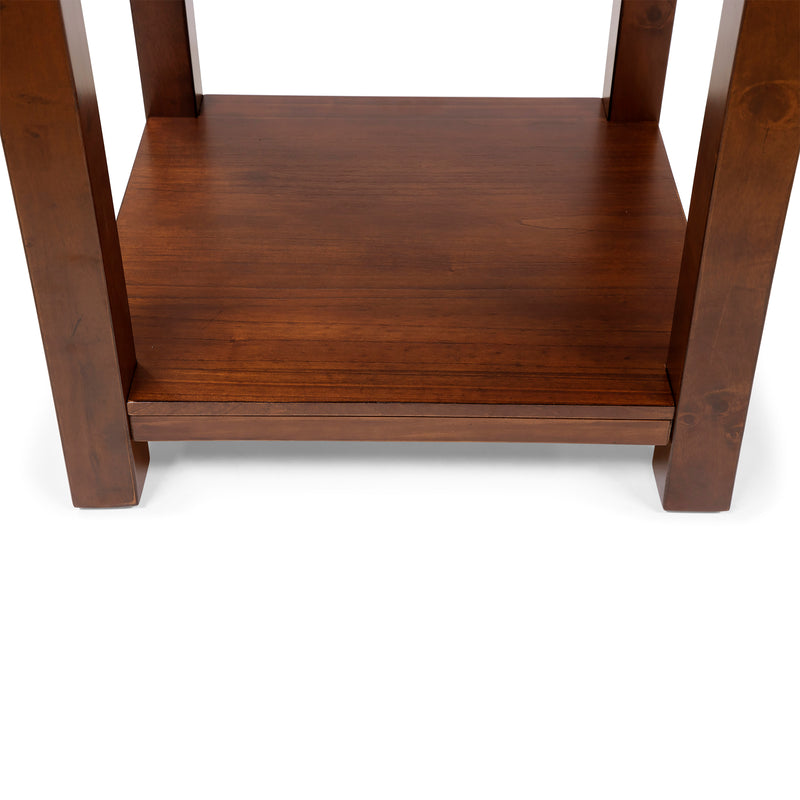 Front-facing top-down view of straight block legs and open bottom shelf of transitional cherry wood end table on a white background