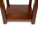 Front-facing top-down view of straight block legs and open bottom shelf of transitional cherry wood end table on a white background