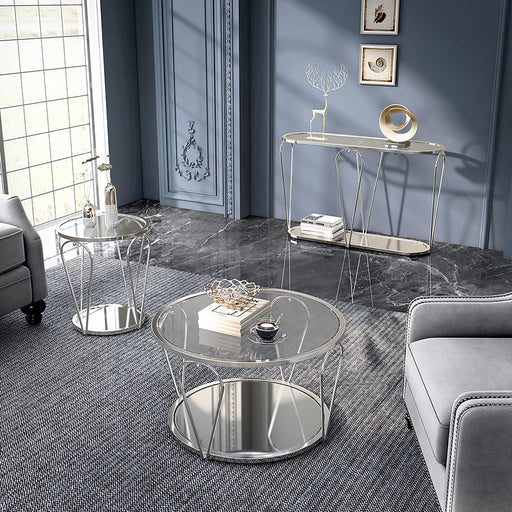 Left angled view of modern round chrome coffee table, end table, and console table set with teardrop legs and mirrored lower shelves decorated in a living room