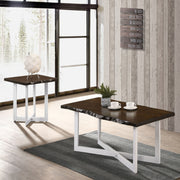 Right angled contemporary live edge oak and white side table in a living area with accessories and matching coffee table