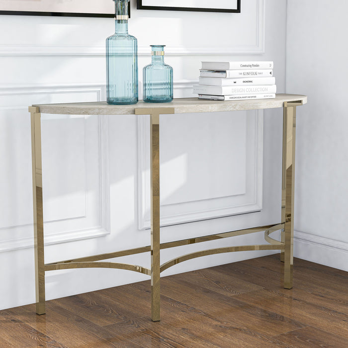 Right angled view of modern glam demilune console table with white faux marble tabletop and champagne steel base decorated in a living room setting