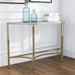 Right angled view of modern glam demilune console table with white faux marble tabletop and champagne steel base decorated in a living room setting