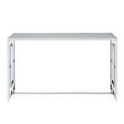 Front-facing view of modern chrome plated steel sofa table with geometric trestle base and water rippled tempered glass top on a white background