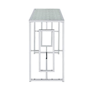 Front-facing side view of modern chrome plated steel sofa table with geometric trestle base and water rippled tempered glass top on a white background